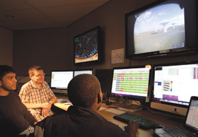 Commissioning scientists (left to right) Nadeem Ozeer, Maik Wolleben and Siphelele Blose in the MeerKAT control room at the Cape Town-based MeerKAT engineering office.<br><i>Image reproduced with the permission of SKA South Africa</i>